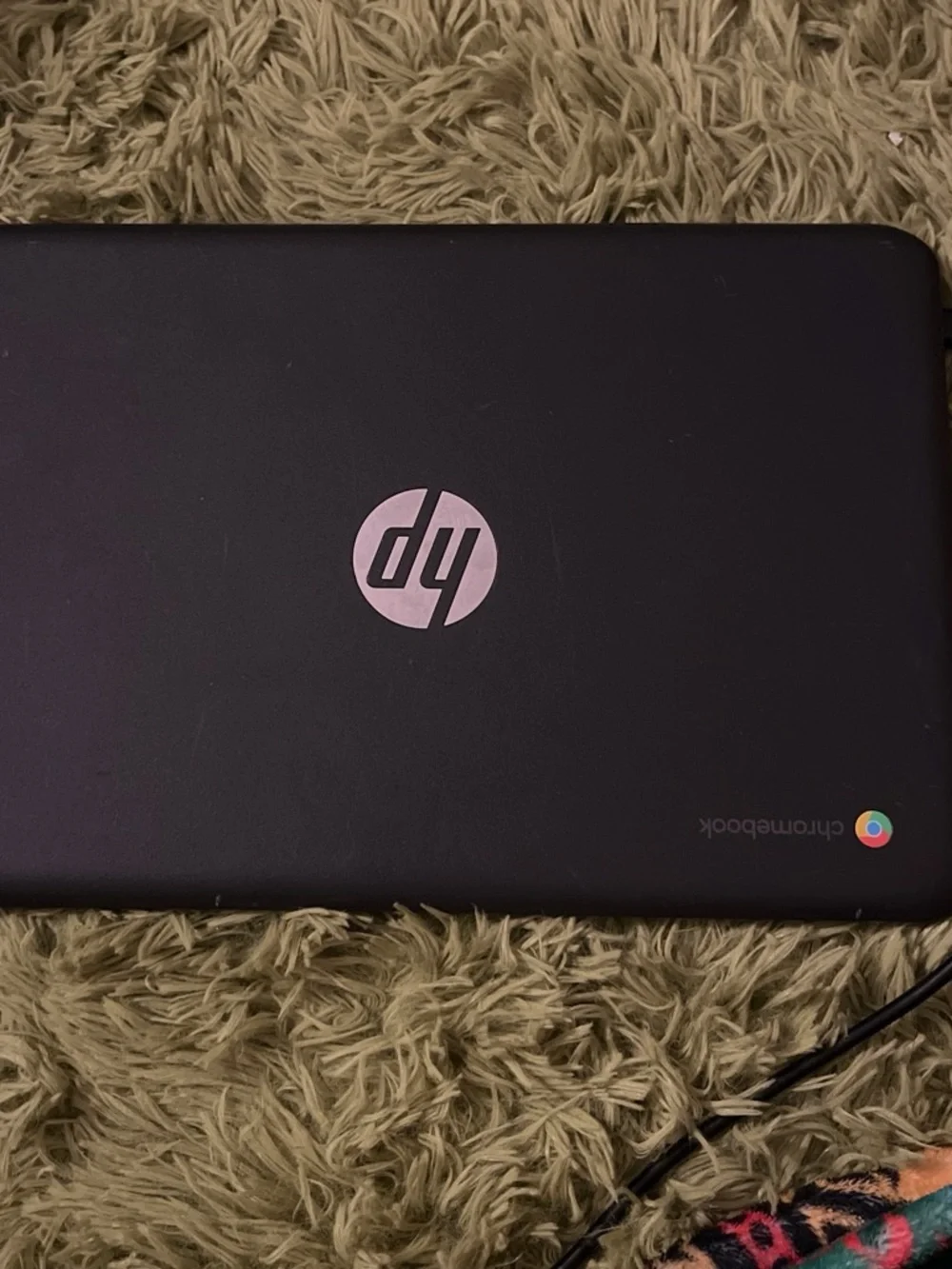 HP Chromebook Black with Chrome OS Logo